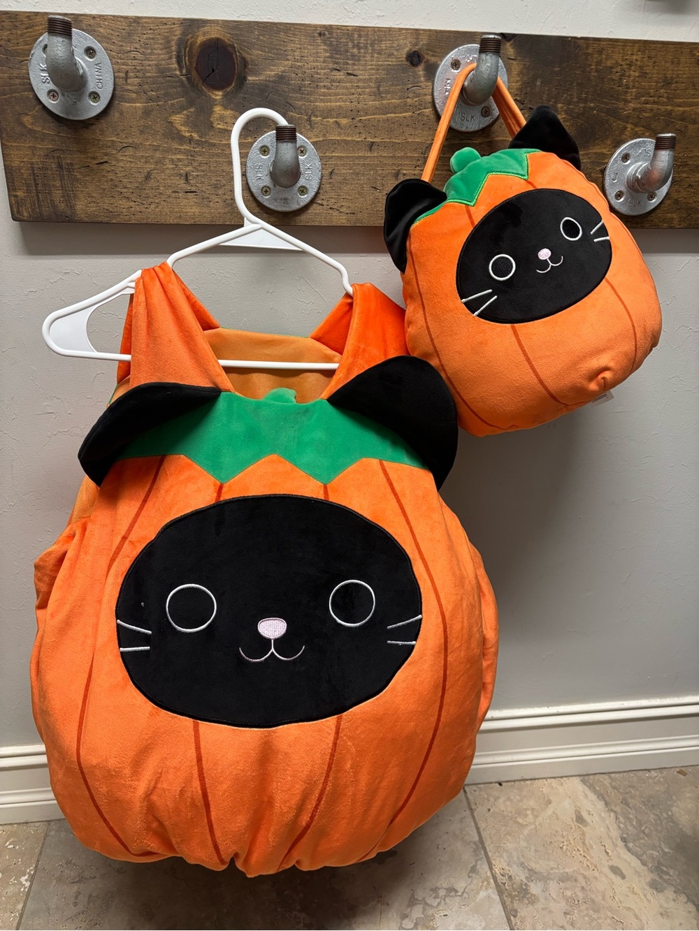 Squishmallows Orange Pumpkin Cat Costume with Black Face and Green Leaf Purse